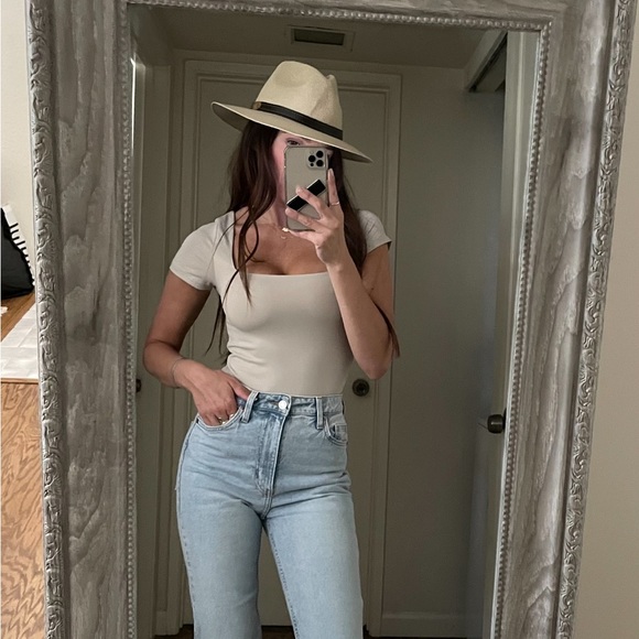 Tops - Short sleeve cream bodysuit.